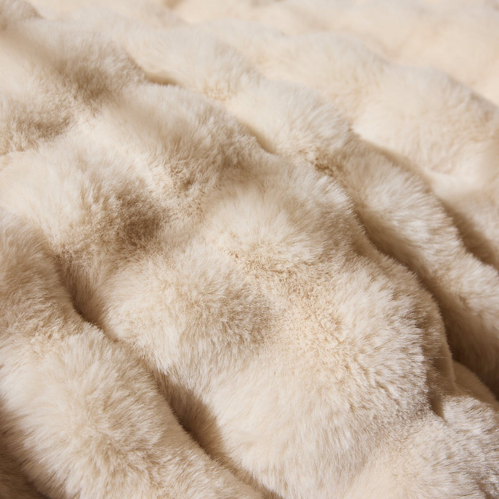 Close-up of beige faux fur texture